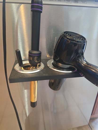 Black hair dryer and curling iron holder mounted on metal surface, magnetic mount