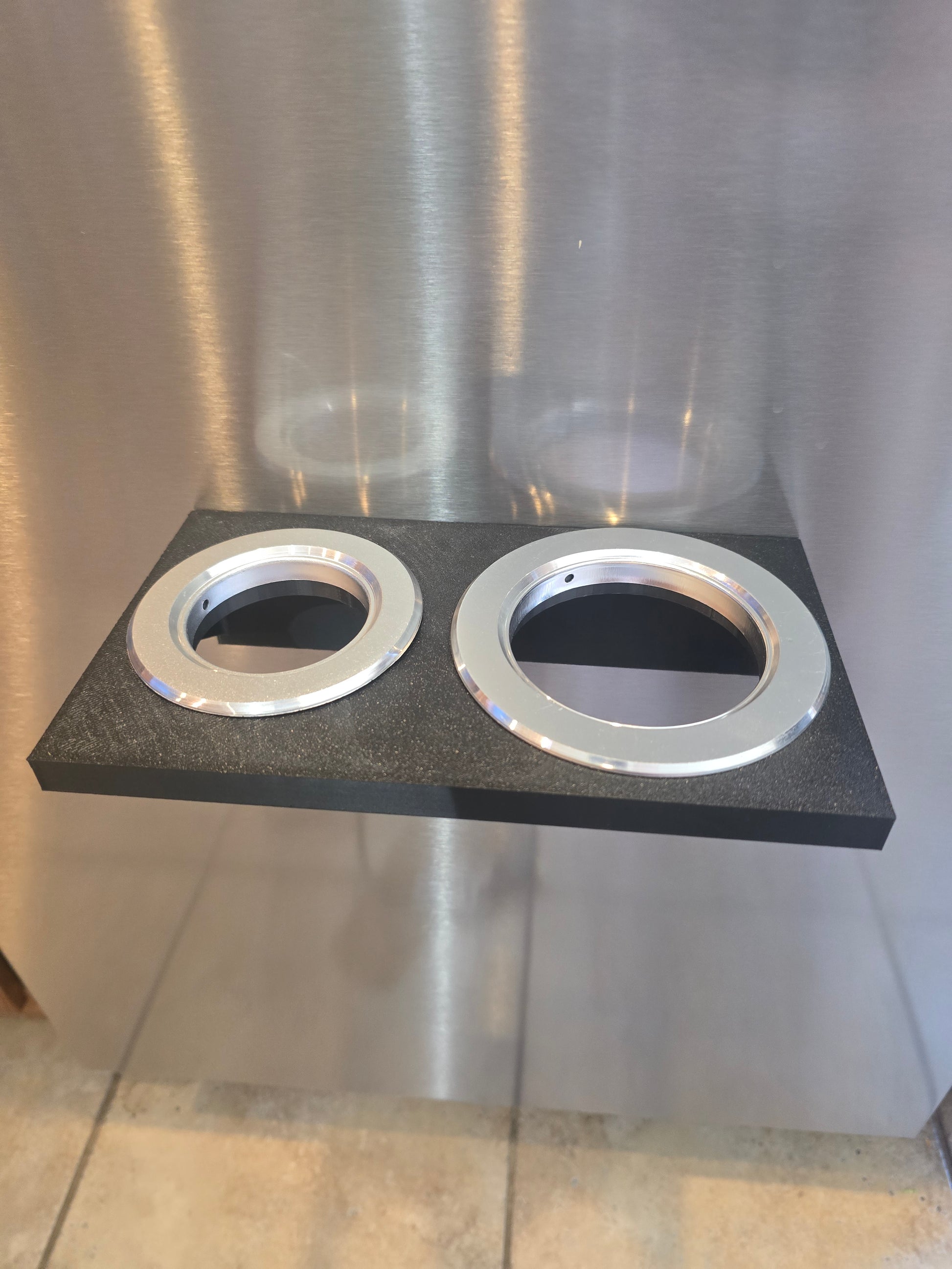 Underside view of hair dryer and curling iron holder showing mount depth